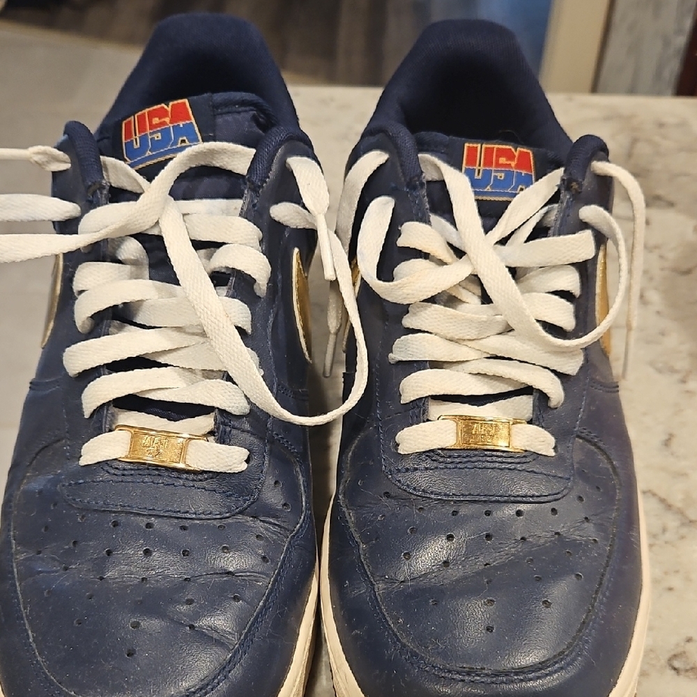 Nike Blue and White Sneakers with Gold Accents